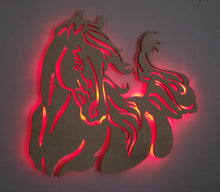 Load image into Gallery viewer, A backlit LED wall art depicting the silhouette of a running horse, crafted from Baltic birch wood.